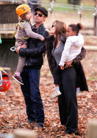 Brad Pitt and Angelina Jolie with their children at a park in Budapest.