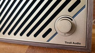 Tivoli Model Two Digital wireless speaker close up on control dial and Tivoli logo