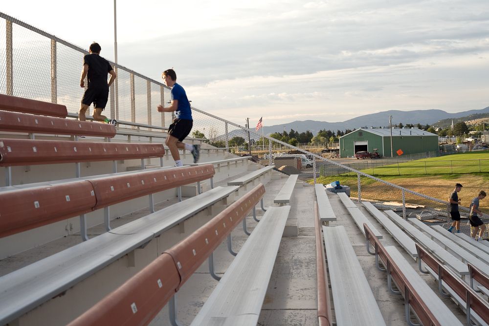 Campers in the men's group run the stairs in Helena