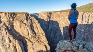 A hiker overlooking the black canyon of the gunnison