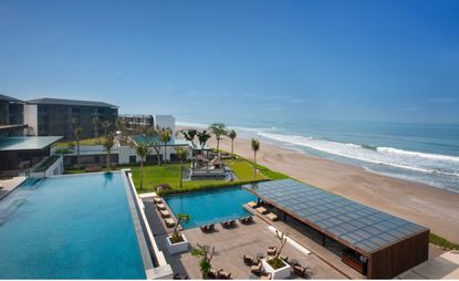 An aerial view of the hotel with a view of the beach 