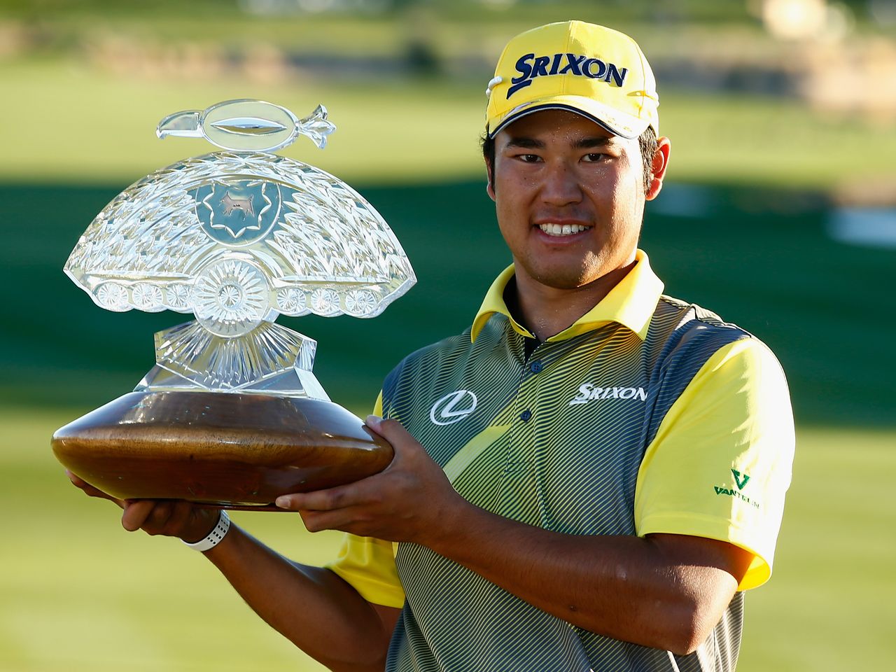 Hideki Matsuyama poses with the trophy having won the Waste Management Phoenix Open at TPC Scottsdale on February 7, 2016. Credit: Getty Images