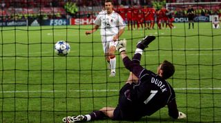 Jerzy Dudek saves from the spot during the penalty shootout
