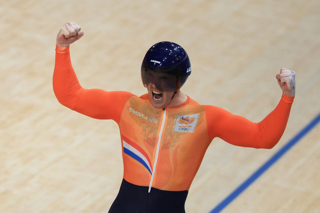 Netherlands' Roy van den Berg celebrates after winning the men's track cycling team sprint final for gold of the Paris 2024 Olympic Games at the Saint-Quentin-en-Yvelines National Velodrome in Montigny-le-Bretonneux, south-west of Paris, on August 6, 2024. (Photo by Emmanuel DUNAND / AFP)