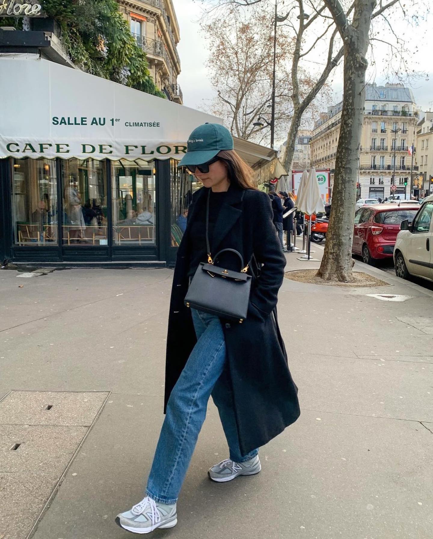 Woman wearing chunky sneakers in Paris