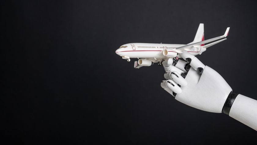 Robotic hand holding airplane model. Integration of robotics and automation in aviation, modernization of flight control technologies