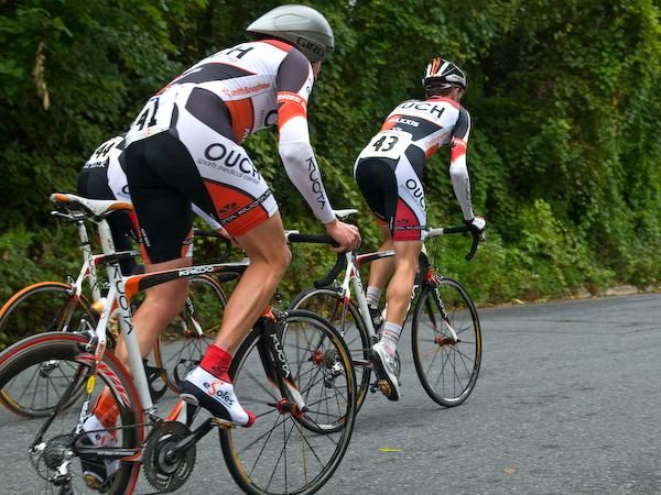 Riders from Team Ouch spread out, breaking formation.