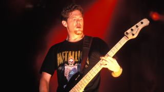 Jason Newsted on stage with Metallica in the 90s