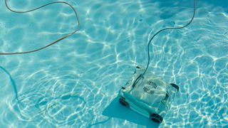 Automatic pool vacuum cleaner in swimming pool