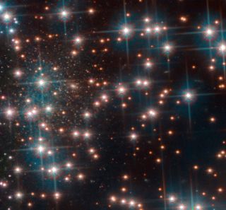 This image, taken with the Hubble Space Telescope's Advanced Camera for Surveys, shows a part the globular cluster NGC 6752. Behind the bright stars of the cluster a denser collection of faint stars is visible — a previously unknown dwarf spheroidal galaxy. This galaxy, nicknamed Bedin 1, is about 30 million light-years from Earth.