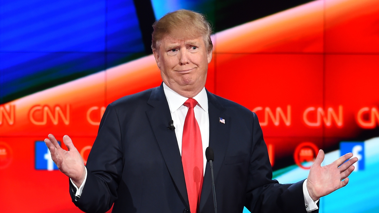 Donald Trump holds his hands out while appearing on CNN in 2015