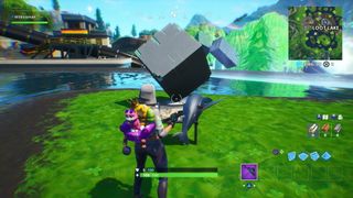 Fortnite Memorial to a Cube by a lake