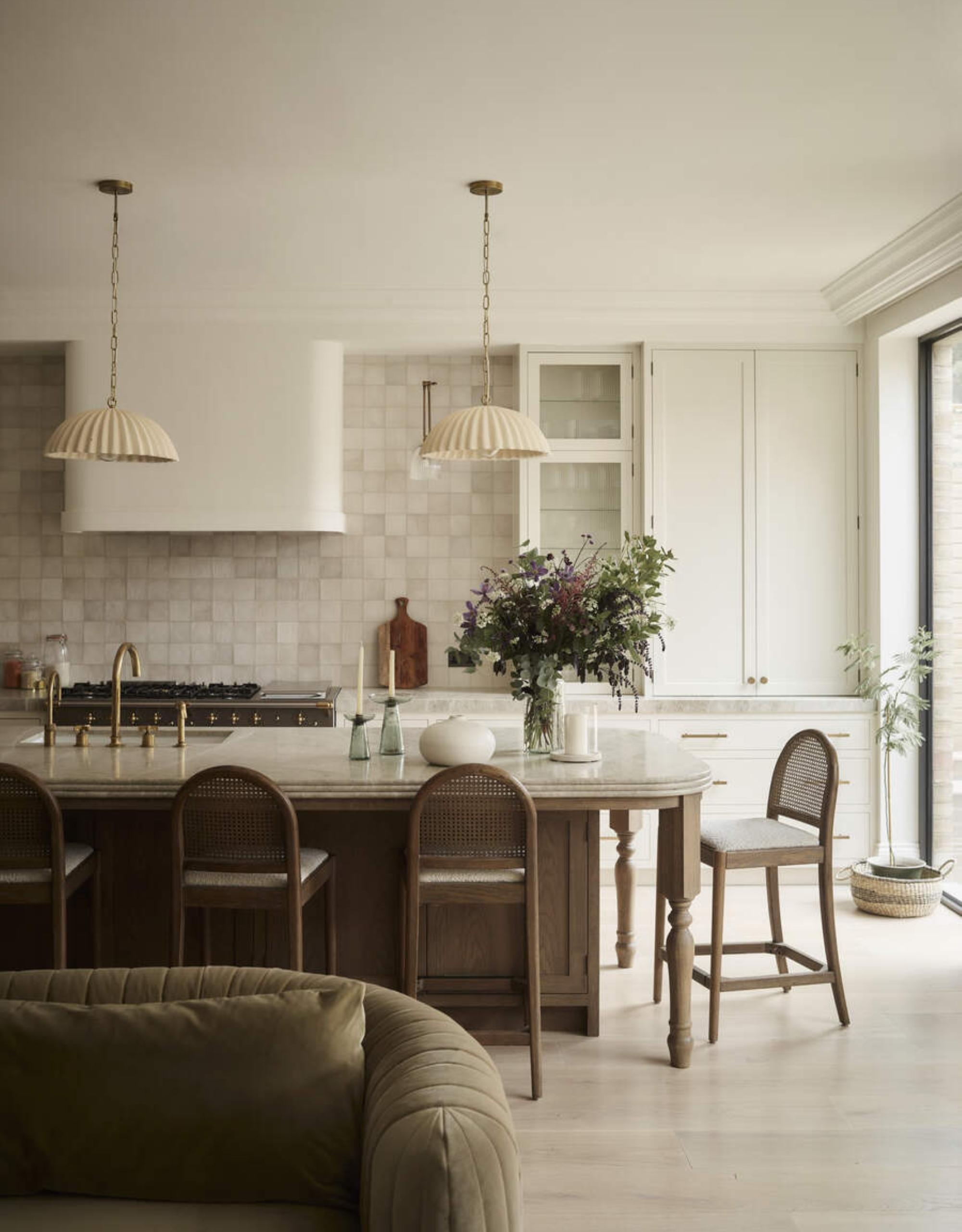 modern neutral kitchen white a white tiled backsplash and wooden island with beige counters