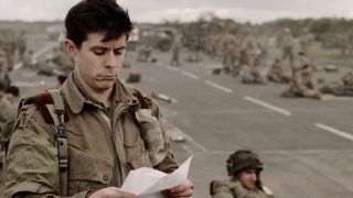 Rick Gomez holding a letter in Band of Brothers