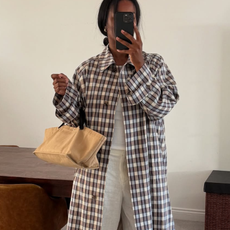 woman wearing plaid jacket trend fall 2025