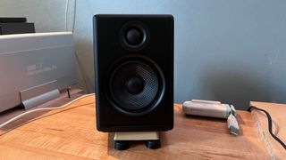 Audioengine A2+ speaker on desktop elevated by DIY stand