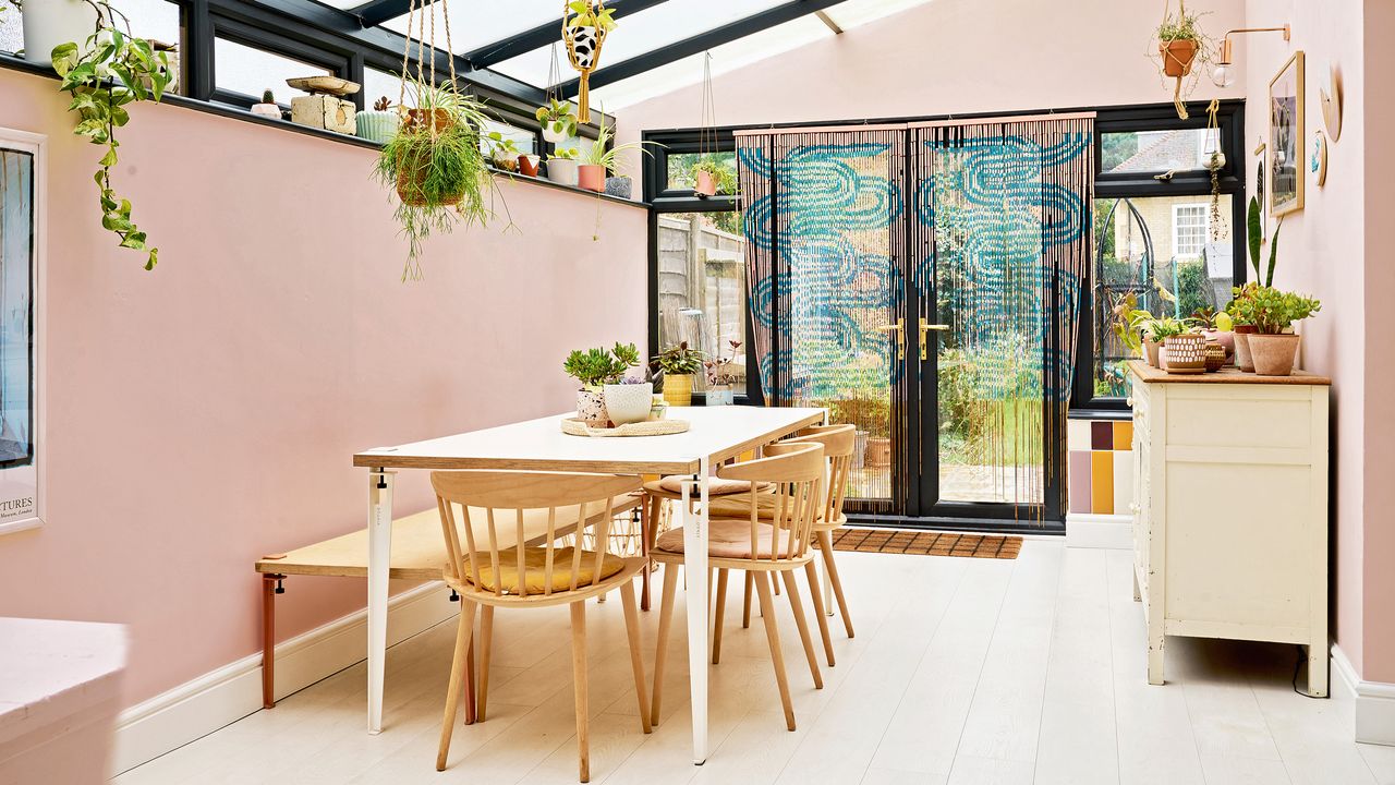 contemporary open plan kitchen diner space with plywood kitchen cabinetry