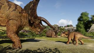 Jurassic World Evolution 3 screenshot of two adult Triceratops and a little baby dinosaur