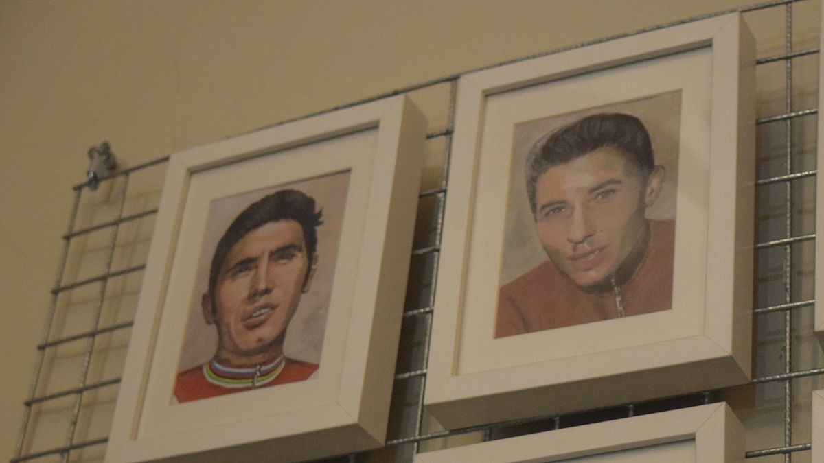 Eddy Merckx and Jacques Anquetil are just two of the portraits that feature on the wall