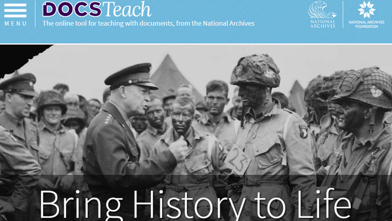 Eisenhower talks to soldiers in the field