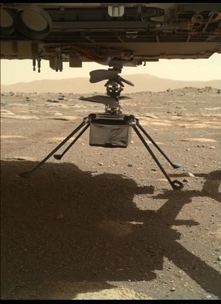 The Mars helicopter Ingenuity with all four legs unfolded, as seen by the Perseverance rover on March 30, 2021.