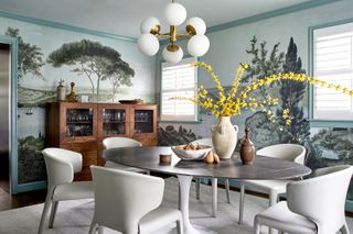 dining room with modern minimalist chairs, and nature scene wallpaper