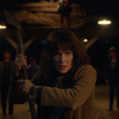 winona ryder as joyce byers preparing to fight something in stranger things season 5