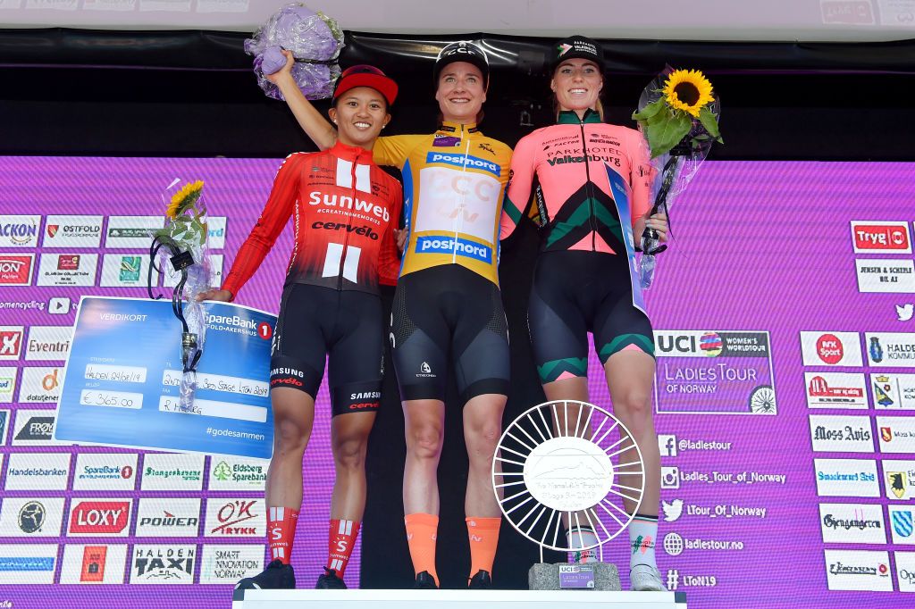 HALDEN NORWAY AUGUST 24 Podium Coryn Rivera of The United States and Team Sunweb Marianne Vos of The Netherlands and Team CCC Liv Orange Leader Jersey Demi Vollering of The Netherlands and Team Parkhotel Valkenburg Celebration Flowers during the 6th Ladies Tour of Norway 2019 Stage 3 a 125km from Mysen to Askim 108m LTourOfNorway LToN UCIWWT on August 24 2019 in Halden Norway Photo by Luc ClaessenGetty Images