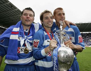 Captain Graeme Murty, Bobby Convey and Steve Sidwell celebrate winning the Championship League with the trophy with a record points scored after the Coca-Cola Championship match between Reading and Queens Park Rangers at the Madejski Stadium on April 30, 2006 in Reading, England. (Photo by Julian Finney/Getty Images)