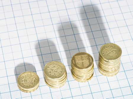 Rising stacks of British Pound coins 