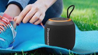 Tronsmart T7 Mini on a yoga mat.