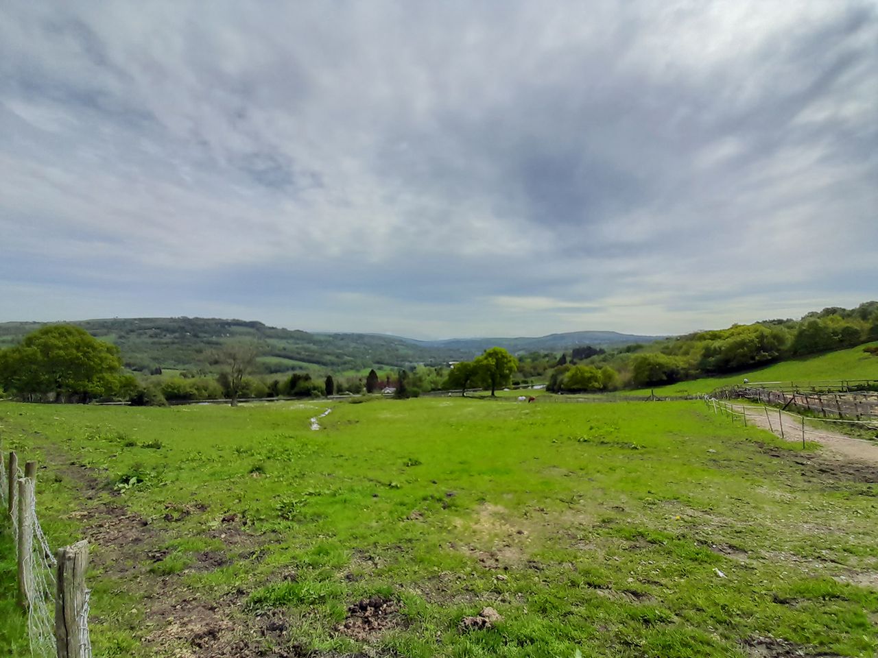 Samsung Galaxy A13 camera sample showing a field and hills (ultrawide mode) in the day