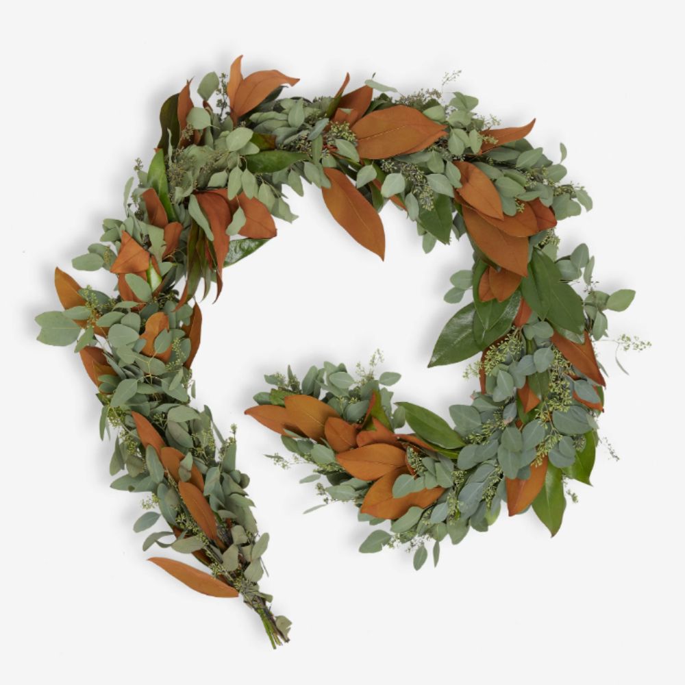 Fresh garland with green and brown foliage