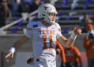 University of Texas quarterback Sam Ehlinger reacts during workouts before a game against the Kansas State Wildcats at Bill Snyder Family Football Stadium on Dec. 5, 2020 in Manhattan, Kan. 