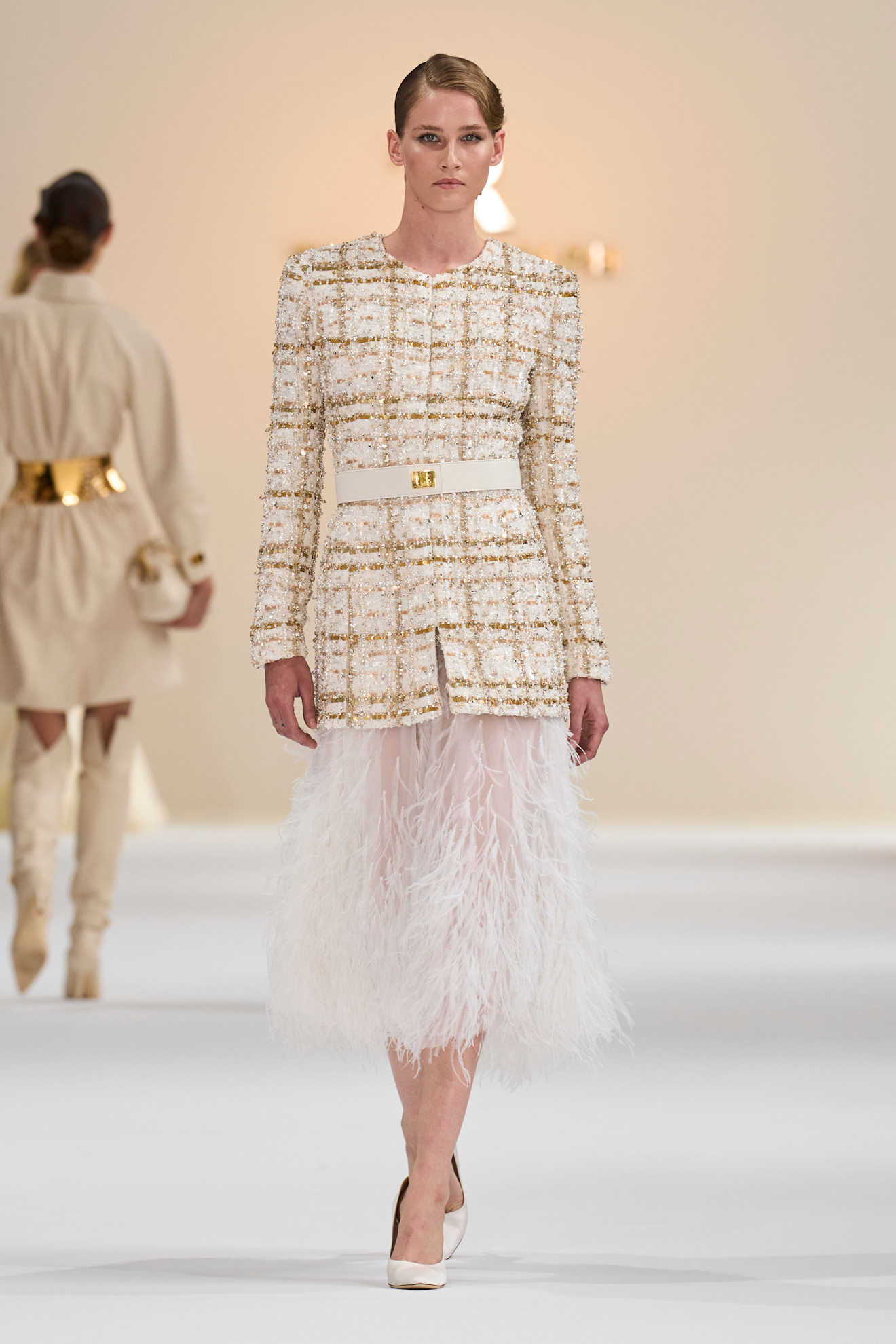 A model wore Blake Lively&#039;s tweed and feather set on the Tamara Ralph fall 2025 couture runway