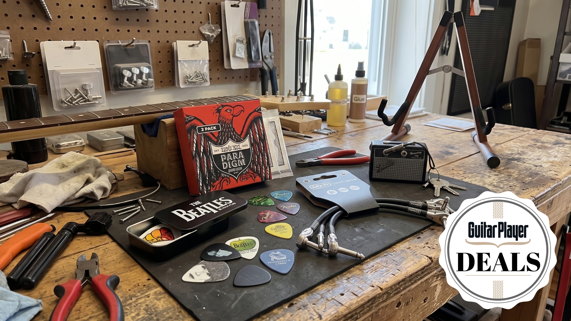 A selection of guitar accessories on a brightly lit workbench