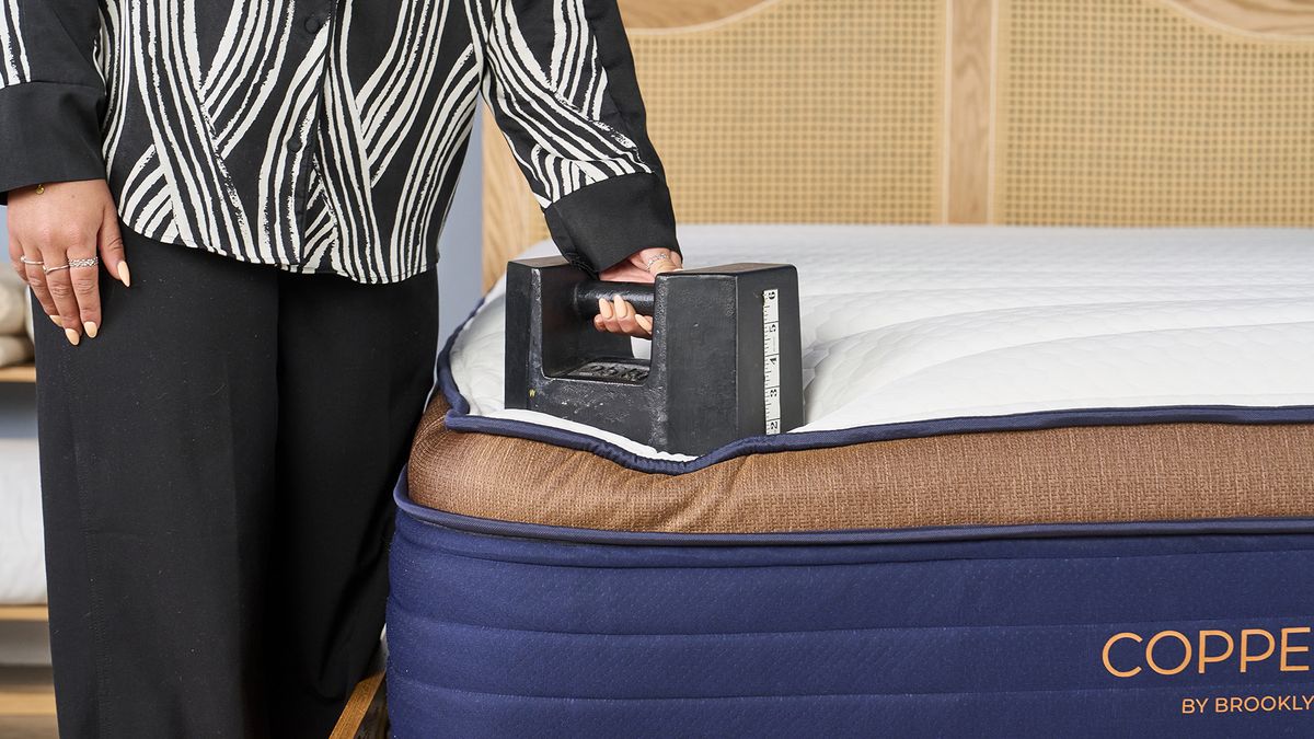 A weight placed on the edge of the Brooklyn Bedding CopperFlex Pro mattress