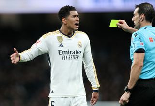 Referee Juan Martinez Munuera shows a yellow card to Jude Bellingham of Real Madrid during the LaLiga EA Sports match between Real Madrid CF and Rayo Vallecano at Estadio Santiago Bernabeu on November 05, 2023 in Madrid, Spain. (Photo by Gonzalo Arroyo Moreno/Getty Images) Manchester City