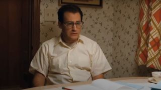 Michael Stuhlbarg sits at his kitchen table with an expression of confusion in A Serious Man.