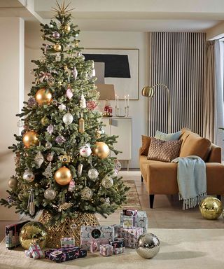 Christmas tree skirt ideas with oversized baubles