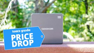 Geekom IT11 shown outdoors on a ledge