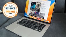 A MacBook on a sofa, with a Live Science Prime Day logo next to it. 