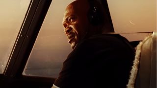 Samuel L Jackson sits at the controls with a questioning look in Snakes on a Plane.