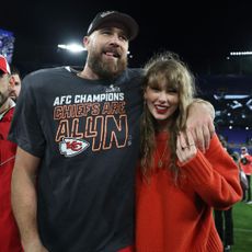 Taylor Swift and Travis Kelce smile together after a Kansas City Chiefs game