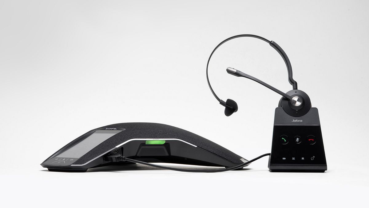 A Konftel speakerphone linked to a Jabra headset.