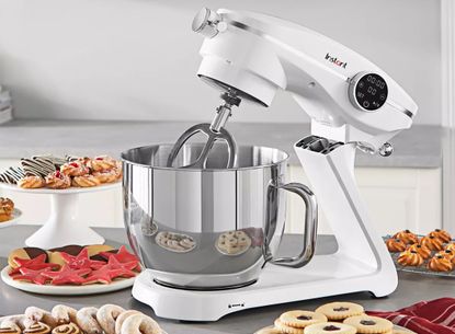 Instant Stand Mixer Pro on a countertop surrounded by baked goods
