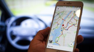 Google Maps on a smartphone screen in a car