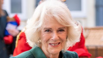 Camilla, Queen Consort, arrives at Barnardo's in a convoy of electric taxis which will transport Paddington teddy bears from Clarence House and Buckingham Palace to attend a special teddy bear's picnic at Barnardo's Nursery in Bow on November 24, 2022 in London, England. It was announced last month that over 1,000 Paddington bears and teddy bears left as tributes in London and Windsor would be donated to Barnardo's children's services. The teddy bears have all been professionally cleaned ahead of the delivery, with those being presented by Her Majesty to remain with children at the Bow Nursery, while others will be distributed to children supported by Barnardo's across the country. The taxis are driven by representatives of the London Taxi Drivers' Charity for Children, of which the then Duchess of Cornwall become Patron in 2010. 