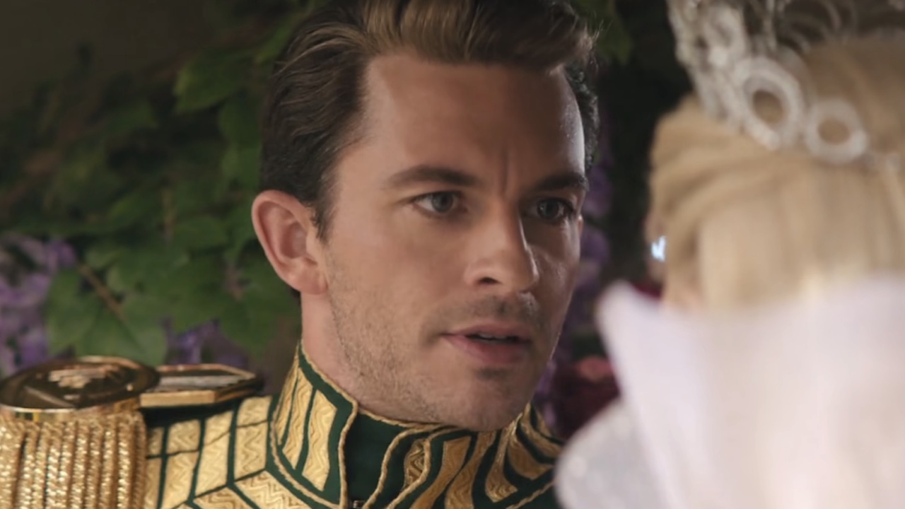 Fiyero in his uniform arguing with Glinda in Wicked: For Good
