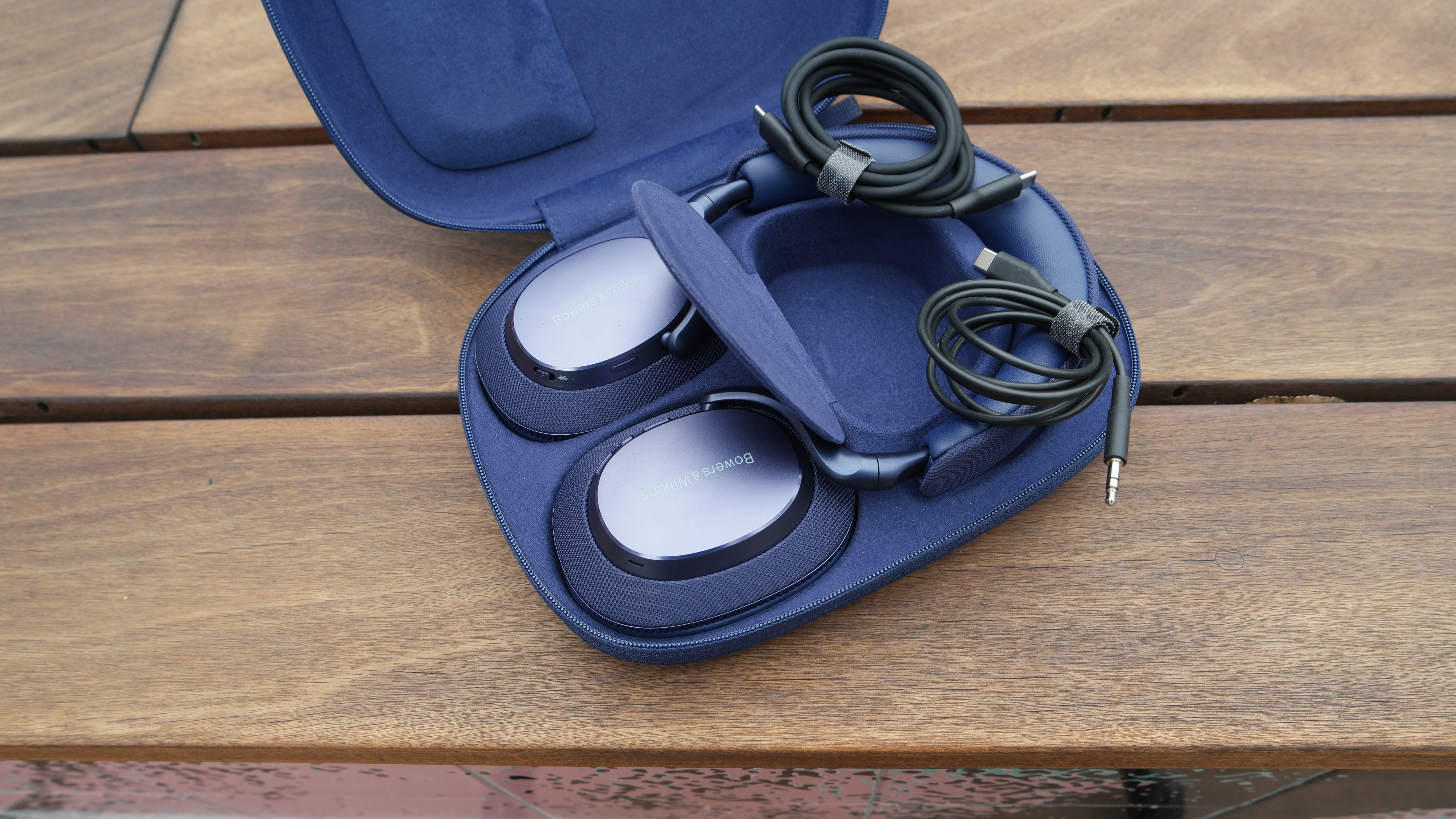 Bowers & Wilkins Px7 S3 in their case, with the accessory storage flap open and included cables showing